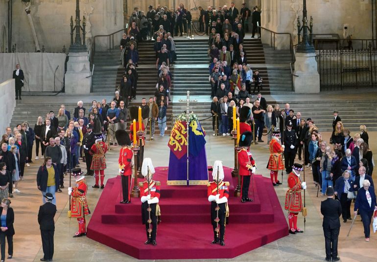 Members of the public pay their respects as they walk past the coffin of Queen Elizabeth II
