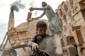 An eight-year-old boy works in a brick factory on the outskirts of Kabul. [Ebrahim Noroozi/AP Photo]