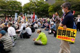 Protesters gather a park in Tokyo on September 23, 2022, demanding the cancellation of former Japanese Prime Minister Shinzo Abe’s state funeral [Yuri Kageyama/AP]