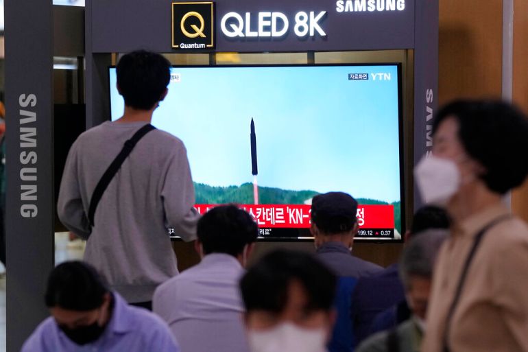A TV screen shows a file image of a North Korean missile launch during a news program at the Seoul Railway Station in Seoul, South Korea, on September 28, 2022 [Ahn Young-joon/AP]