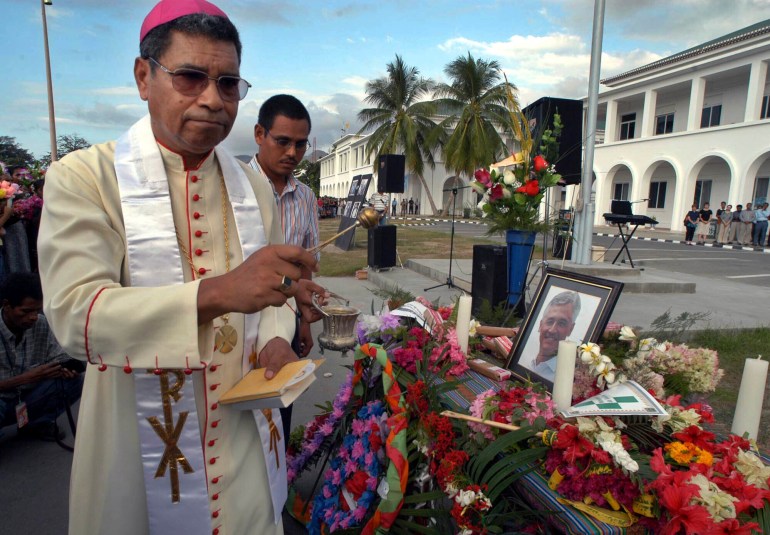East Timor's Roman Catholic Bishop and Nobel Prize laureate Carlos Ximenes Belo prays in a ceremony to pay last respects to the former head of the UN Transition Authority in East Timor, Sergio Vieira De Mello in Dili, on Aug. 23, 2003. 