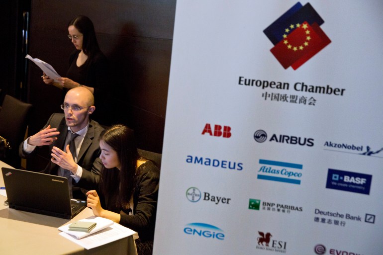 Staff members with the European Chamber of Commerce prepare for a press conference in Beijing, China, in 2015.