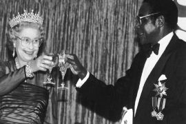 Britain's Queen Elizabeth II joins in a toast with President Robert Mugabe of Zimbabwe, during a banquet in the Queen's honor in Harare, Zimbabwe on Oct. 10, 1991, during her first visit since 1947.
