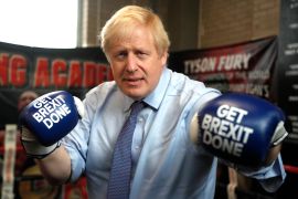 Boris Johnson with boxing gloves reading: Get Brexit done