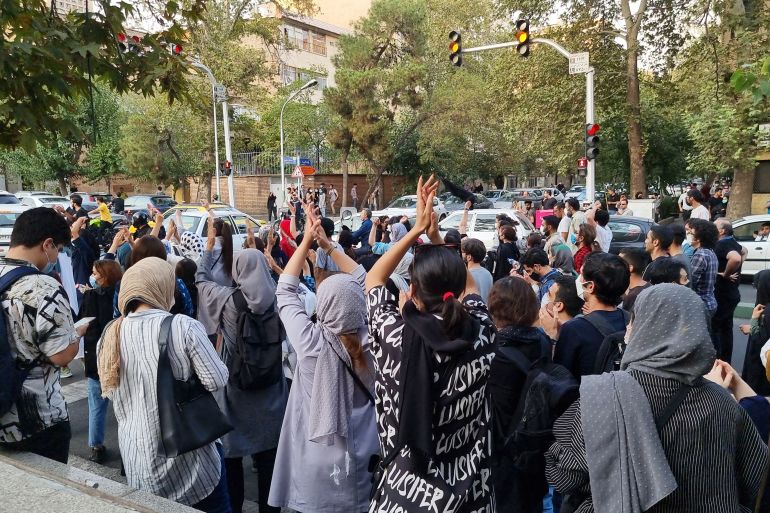 People gather in protest against the death of Mahsa Amini along the streets on September 19, 2022 in Tehran, Iran.