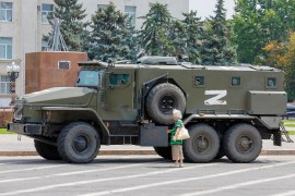 An armoured truck of pro-Russian troops is parked in the occupied Ukraine city of Kherson [File: Alexander Ermochenko]