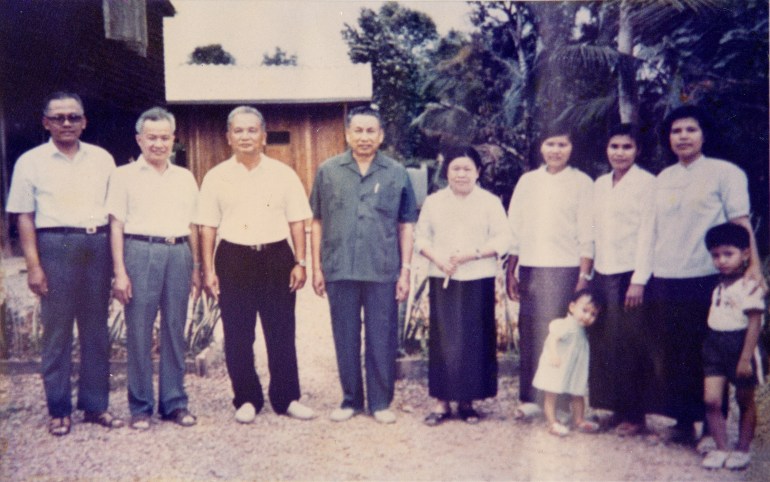 Group photo of Khmer Rouge Minister of National Defence Son Sen, Head of State Khieu Samphan, "Brother No. 2" Nuon Chea, "Brother No. 1. Pol Pot, Yon Yat, the regime's minister of culture, education and propaganda, Meas Sophy, Pol Pot's first wife, Sar Phacheta, Pol Pot's daughter.