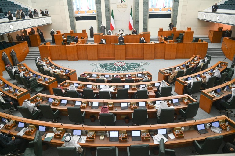 Members of parliament and Ministers attend a regular session of the Kuwait National Assembly