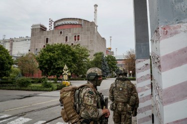 Russian service members guard the territory around the Zaporizhzhia Nuclear Power Plant in Enerhodar, southeastern Ukraine.