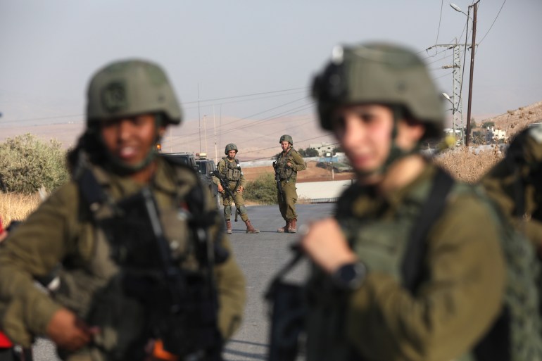 Israeli soldiers conduct a search operation at the area near Atof village south of Nablus city after the shooting attack at Israeli bus near the Jordan valley, 04 September 2022
