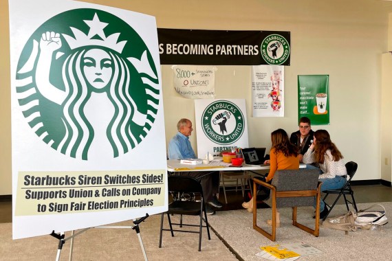 Richard Bensinger, left, who is advising unionization efforts, along with baristas Casey Moore, right, Brian Murray, second from left, and Jaz Brisack, second from right, discuss their efforts to unionize three Buffalo-area stores, inside the movements headquarters on Thursday, Oct. 28, 2021 in Buffalo, N.Y