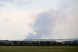 Black smoke is seen over the city of Lyman, Donetsk region [File: Anatolii Stepanov/AFP]