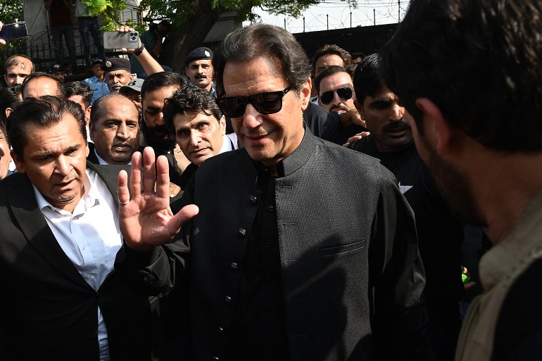 Pakistan's former Prime Minister Imran Khan (C) gestures as he leaves after appearing before the High Court in Islamabad on September 22, 2022.