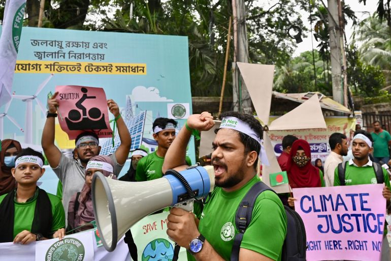 Activists take part in a rally to mark the Global Climate Strike in Dhaka on September 23, 2022. (Photo by Munir UZ ZAMAN / AFP)