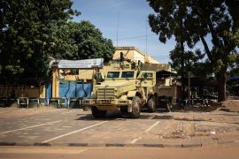 A military vehicle is seen in front of Burkina Faso national television, in Ouagadougou