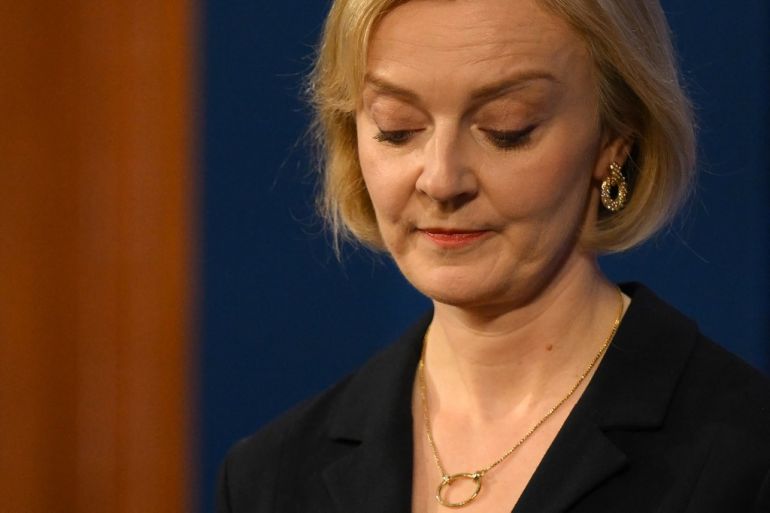 Britain's Prime Minister Liz Truss looks down during a press conference