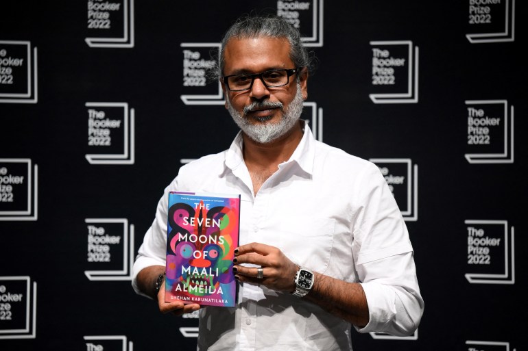 Sri Lankan author Shehan Karunatilaka holds his book The Seven Moons of Maali Almeida.