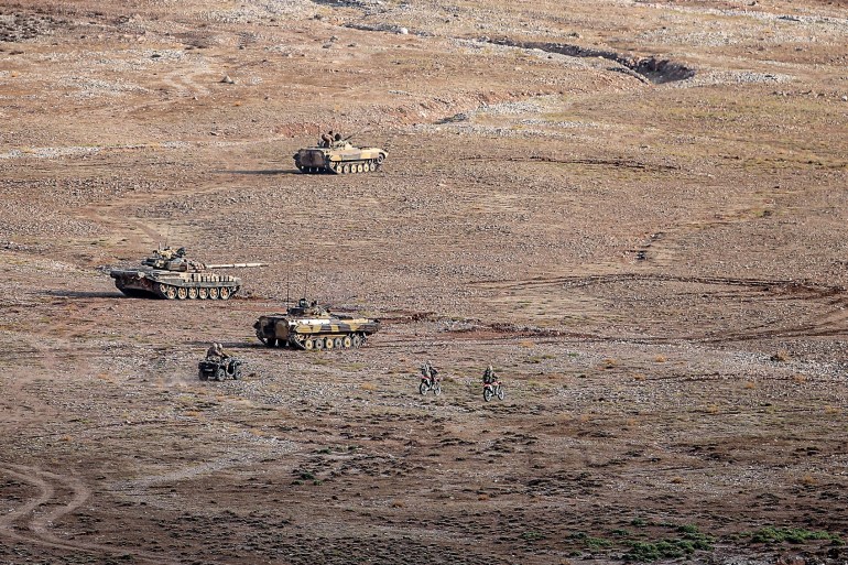 This handout photo provided by Iran's Revolutionary Guard Corps (IRGC) official website via SEPAH News on October 20, 2022 shows the Islamic Revolutionary Guard Corps (IRGC) taking part in a military drill in the northwestern region of Aras along the borders of Armenia and Azerbaijan. 