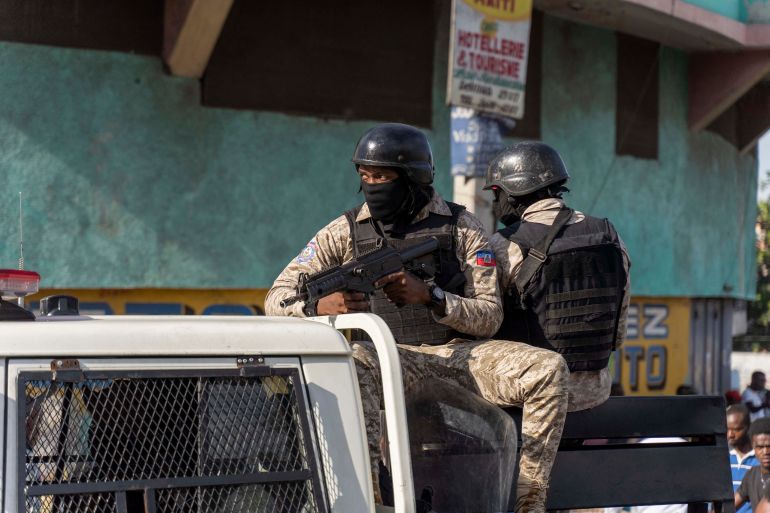 Police forces patrol the streets during a demonstration against Haitian Prime Minister Ariel Henry and the United Nations amid a health and security crisis in Port-au-Prince on October 21, 2022.