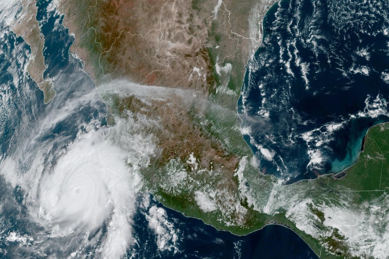 This satellite image from the National Oceanic and Atmospheric Administration shows Hurricane Roslyn approaching Mexico's Pacific coast on October 22, 2022, at 15:50UTC. - Roslyn strengthened to a major Category 4 storm on Saturday, the US National Hurricane Center (NHC) said, warning of potentially damaging winds, dangerous storm surge and flash flooding. The storm was some 150 miles (240kms) west-southwest of Manzanillo, with maximum sustained winds of 130 miles per hour (209kph), and is forecast to slam into the coast of Nayarit state on October 23 at or near major hurricane strength, the NHC said (Photo by Handout / NOAA/GOES / AFP) / RESTRICTED TO EDITORIAL USE - MANDATORY CREDIT "AFP PHOTO / NOAA/GOES" - NO MARKETING NO ADVERTISING CAMPAIGNS - DISTRIBUTED AS A SERVICE TO CLIENTS