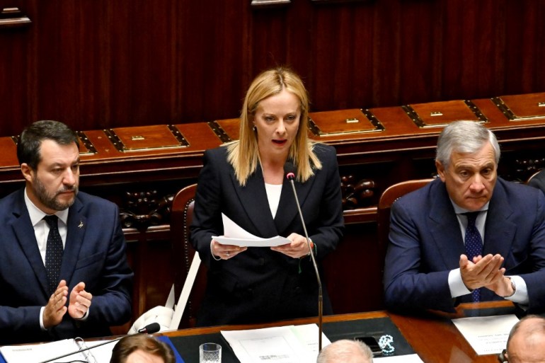Italys new Prime Minister Giorgia Meloni (C) speaks in her first address to parliament