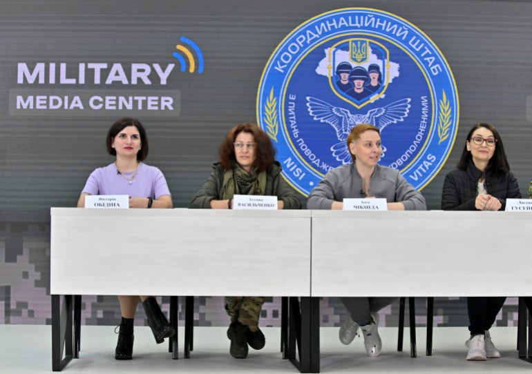 (From L to R) Former prisoners Viktoria Obidina, a military nurse, Ukrainian medic Tetyana Vasylchenko, Inga Chikinda, an army marine, Lyudmyla Guseynova, a volunteer from the eastern Donetsk region, deliver a press conference in Kyiv on October 26, 2022. - Four of the women spoke to journalists in Kyiv on October 26, 2022 to recount what they have lived through: packed prison cells, hunger, physical abuse and humiliation. More than one hundred women were freed from Russian detention as part of a long-negotiated prisoner exchange with Moscow. (Photo by Sergei SUPINSKY / AFP)