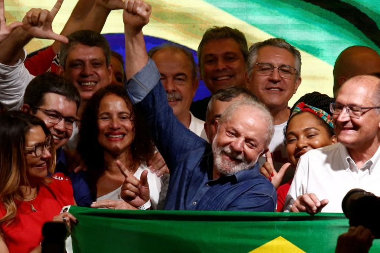 Luiz Inacio Lula da Silva waves at his supporters after being elected president in Sunday's election [Carla Carniel/Reuters]