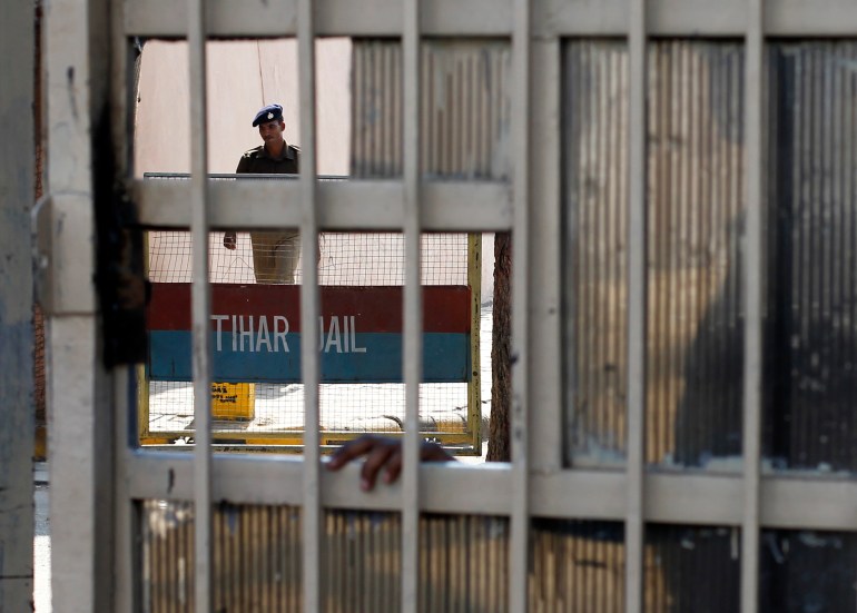 A policeman walks inside the Tihar Jail in New Delhi March 1