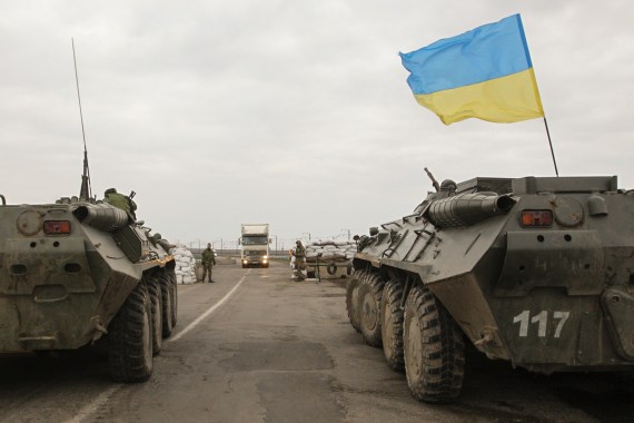 Ukrainian soldiers and armoured personnel carriers guard a checkpoint near the village of Salkovo, in the Kherson region of Ukraine.