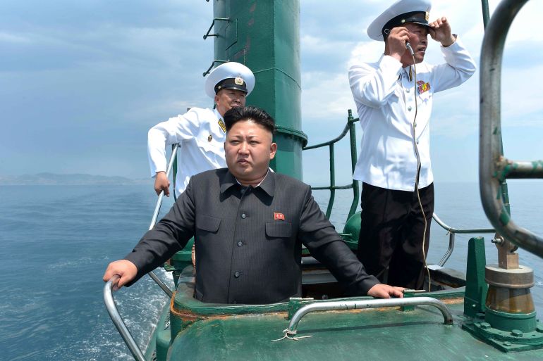 North Korean leader Kim Jong Un stands on the conning tower of a submarine during his inspection of the Korean People's Army (KPA) Naval Unit 167 in this undated photo released by North Korea's Korean Central News Agency in Pyongyang.