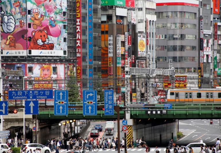 A busy Tokyo street crossing.