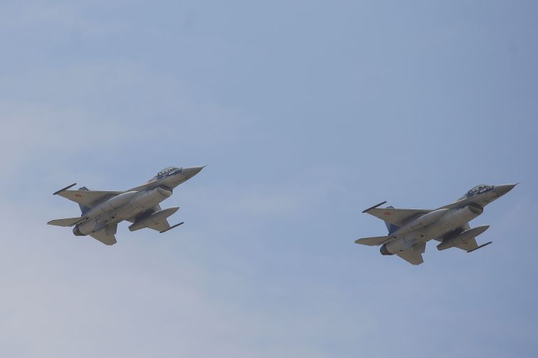 Two F-16 planes perform a fly-by in proximity of the 85th Air Base of the Romanian Air Force during the official presentation ceremony of 6 F-16 planes.