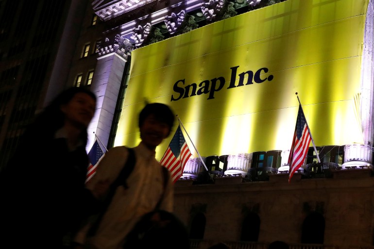 A Banner for Snap Inc. hangs on the facade of the the New York Stock Exchange (NYSE) on the eve of the company's IPO in New York, US