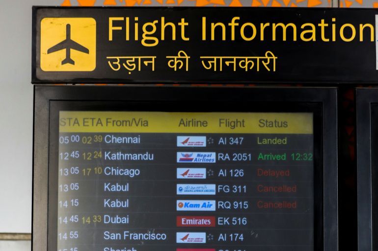 A flight Information board showing flights cancelled from Kabul is pictured at the Indira Gandhi International Airport in New Delhi