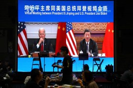 A screen shows Chinese President Xi Jinping attending a virtual meeting with US President Joe Biden via video link in November 2021 [Tingshu Wang/Reuters]