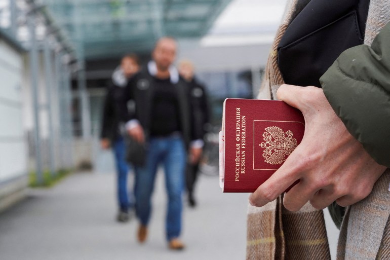 A person holds a Russian Passport at Vaalimaa border crossing point between Russia and Finland