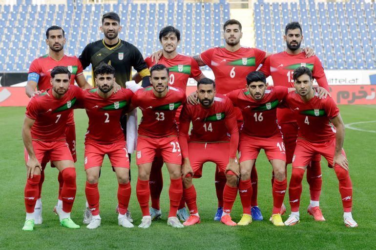 Iranian players pose for a team group photo before a match