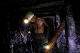Miner Juan Briones, 35, walks through the entrance of a coal mine, in Sabinas, Mexico. [Daniel Becerril/Reuters]