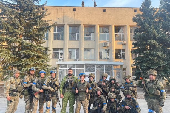 Ukrainian troops pose for a photo in Lyman, Ukraine