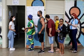 Voters wait in line to cast their ballots at a polling station, in Brasilia, Brazil [Ueslei Marcelino/Reuters]