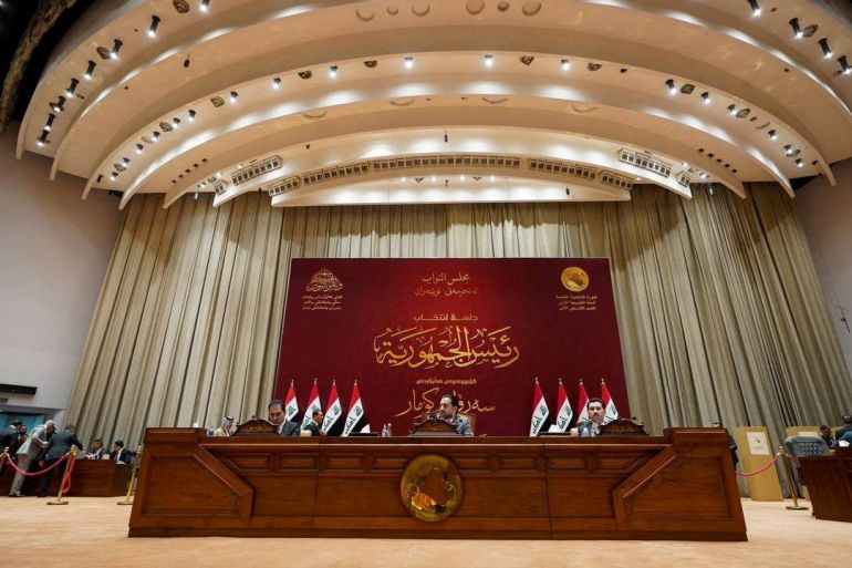 Iraqi lawmakers attend a parliamentary session to vote for a new head of state president