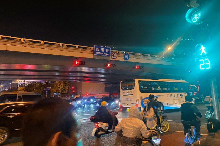 Cars travel under Sitong bridge in Beijing's Haidian district, China on October 13, 2022 [Eduardo Baptista/Reuters]