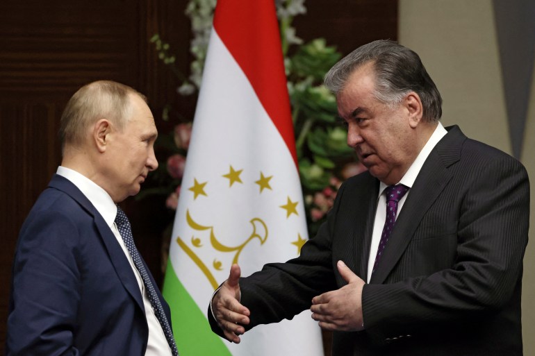 Russia's President Vladimir Putin, and Tajikistan's President Emomali Rakhmon talk ahead of trilateral meeting with Kyrgyzstan's President Sadyr Japarov on the sidelines of the 6th summit of the Conference on Interaction and Confidence-building Measures in Asia (CICA), in Astana, Kazakhstan October 13, 2022. Sputnik/Vyacheslav Prokofyev/Pool via REUTERS ATTENTION EDITORS - THIS IMAGE WAS PROVIDED BY A THIRD PARTY.