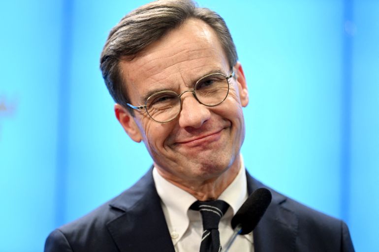 Sweden's Moderate Party leader Ulf Kristersson reacts, after being confirmed as new prime minister
