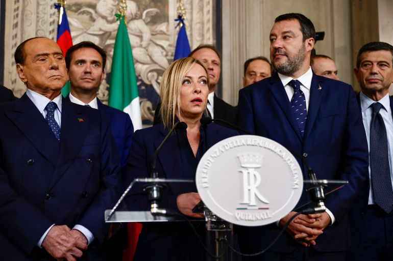 Brothers of Italy leader Giorgia Meloni speaks to the media as she stands next to Forza Italia leader and former Prime Minister Silvio Berlusconi and League party leader Matteo Salvini, following a meeting with Italian President Sergio Mattarella at the Quirinale Palace