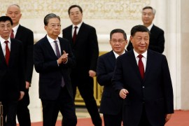 New Politburo Standing Committee members Xi Jinping, Li Qiang, Zhao Leji, Wang Huning, Cai Qi, Ding Xuexiang and Li Xi arrive to meet the media