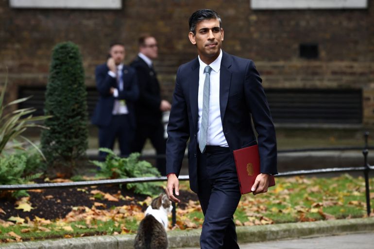 Britain's new Prime Minister Rishi Sunak walks outside Number 10 Downing Street, in London, Britain, October 25, 2022. REUTERS/Henry Nicholls
