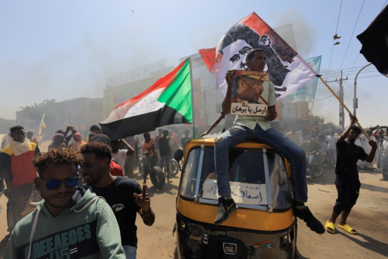 Protesters march during a rally against military rule following the last coup, in Khartoum, Sudan, October 25, 2022