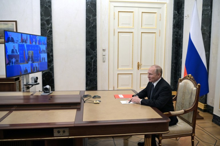 Russian President Vladimir Putin chairs a meeting with members of the Security Council via a video link in Moscow, Russia October 26, 2022.