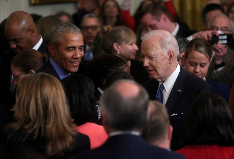Joe Biden and Barack Obama stand next to each other after a 2022 White House ceremony